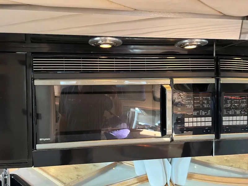 Slide: The Image of Built-in microwave in 1990 Tempest Offshore Sport Yacht kitchen. - 27