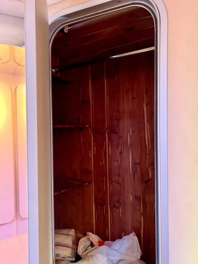 Slide: The Image of Wooden closet interior on a 1990 Tempest Offshore Sport Yacht. - 34