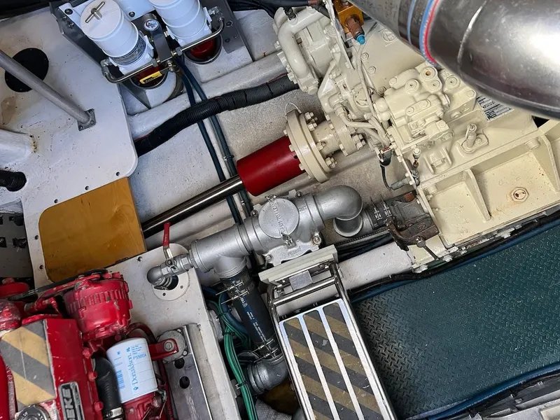 Slide: The Image of Engine compartment of a 1990 Tempest Offshore Sport Yacht with visible machinery and components. - 41