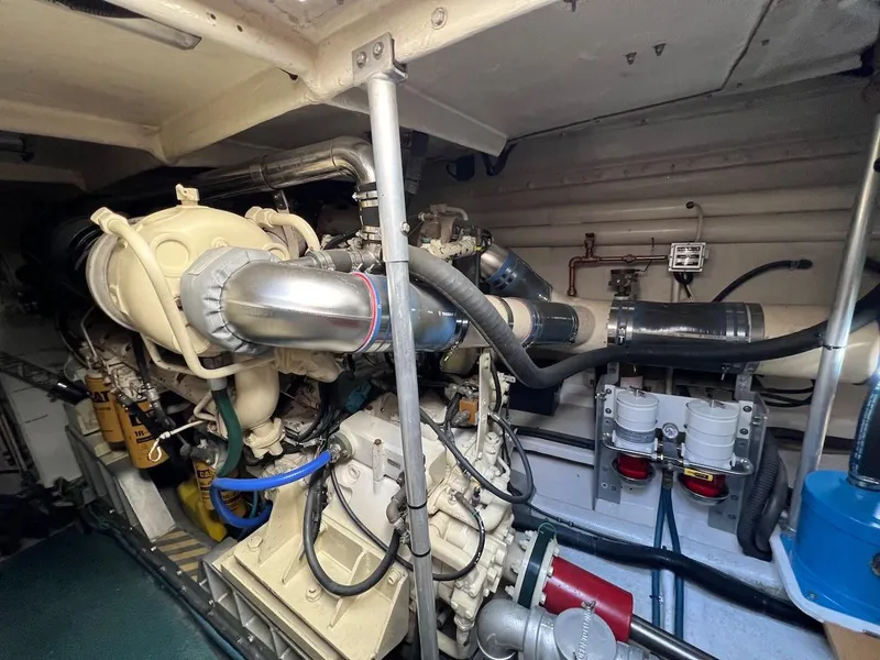 Slide: The Image of Engine room of a 1990 Tempest Offshore Sport Yacht with visible machinery and components. - 45