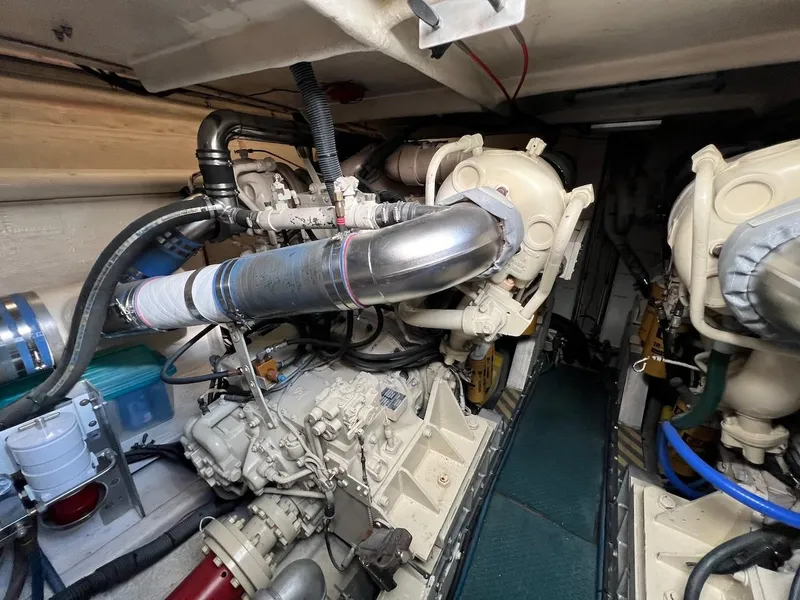 Slide: The Image of Engine room of a 1990 Tempest Offshore Sport Yacht, showcasing mechanical components. - 46