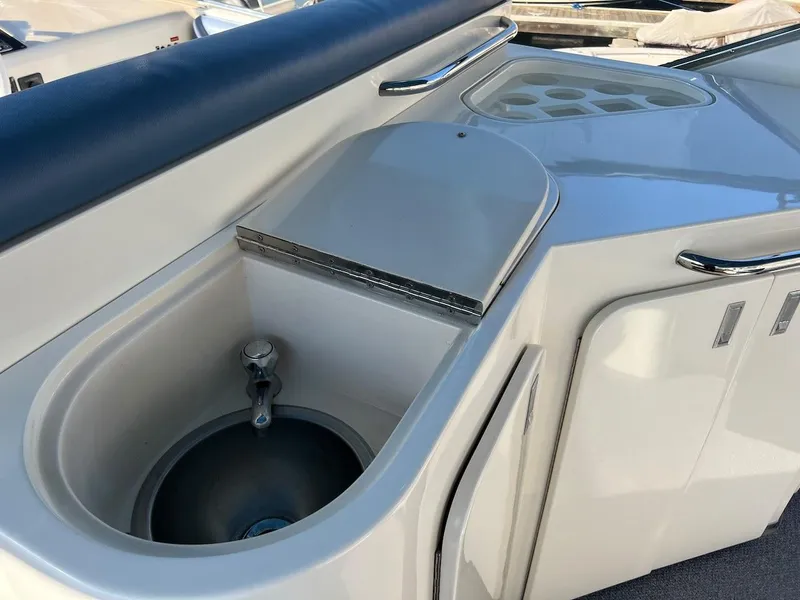 Slide: The Image of 1990 Tempest Offshore Sport Yacht sink and countertop area. - 9