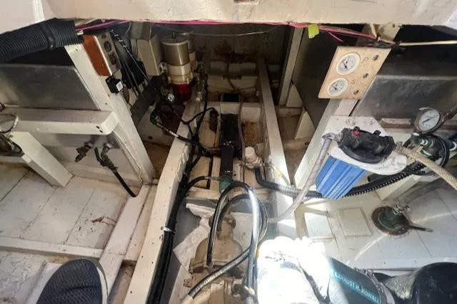 Slide: The Image of Engine room of a 1972 Grand Banks Trawler, showcasing mechanical components and wiring. - 10