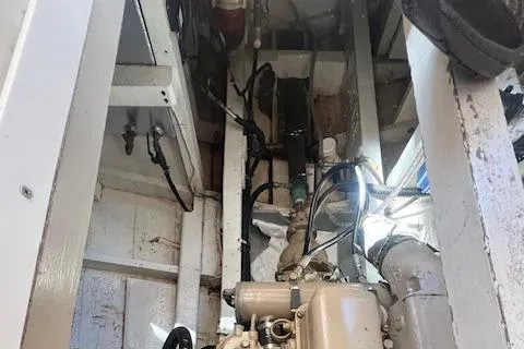 Slide: The Image of 1972 Grand Banks Trawler engine room with visible machinery and piping. - 8