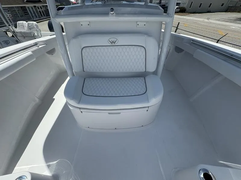 Slide: The Image of 2024 Southport 30 FE boat interior with cushioned seating and storage. - 10