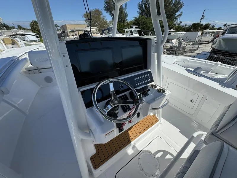 Slide: The Image of 2024 Southport 30 FE boat helm with modern controls and dual screens. - 18