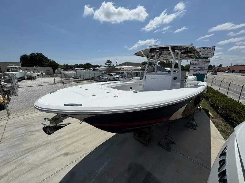 Slide: The Image of 2024 Southport 30 FE boat on display at a dealership. - 2