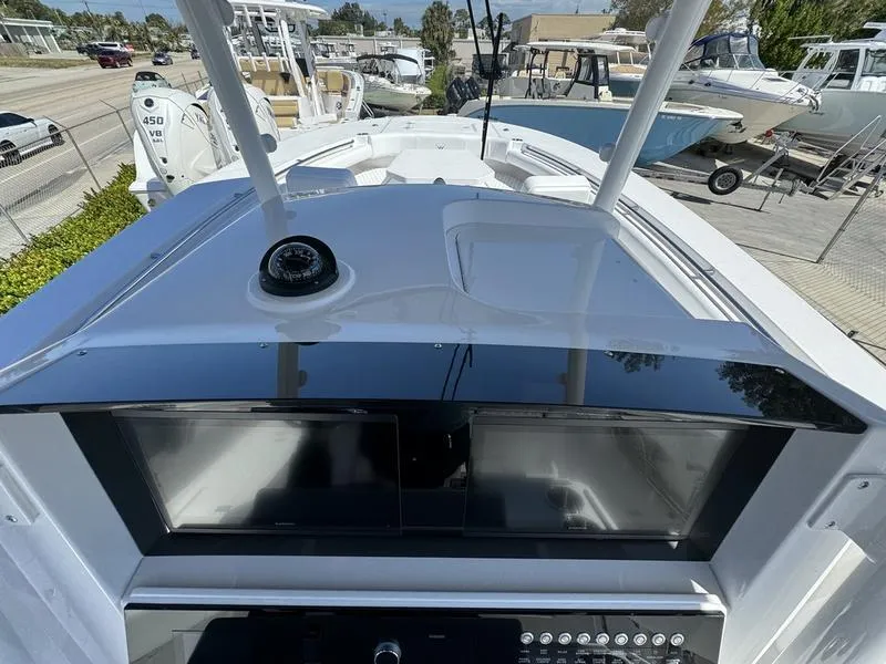 Slide: The Image of 2024 Southport 30 FE boat dashboard and controls. - 22