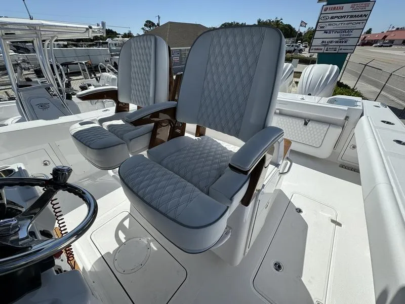 Slide: The Image of 2024 Southport 30 FE boat with luxurious seating and modern helm. - 25