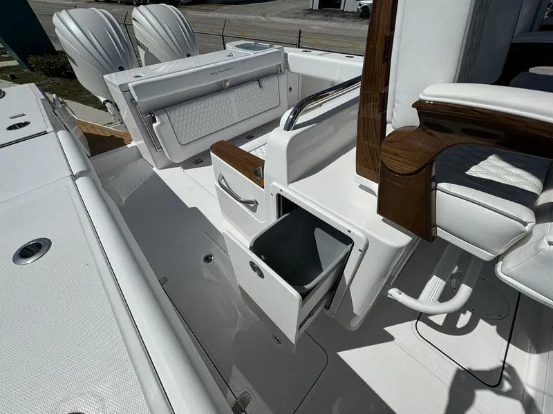 Slide: The Image of 2024 Southport 30 FE boat interior with storage compartments and seating. - 27
