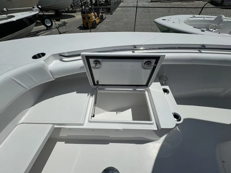 Slide: The Image of 2024 Southport 30 FE boat with open storage compartment. - 6