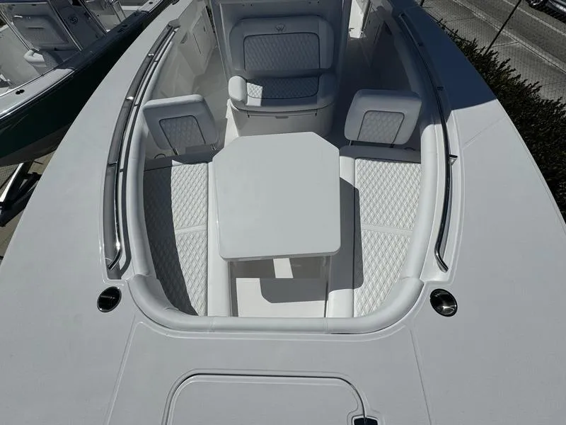 Slide: The Image of 2024 Southport 30 FE boat with spacious seating and table in the bow. - 9