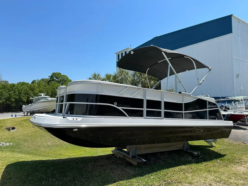Slide: The Image of 2024 Hurricane FunDeck 2260 RE OB pontoon boat on display outdoors. - 0