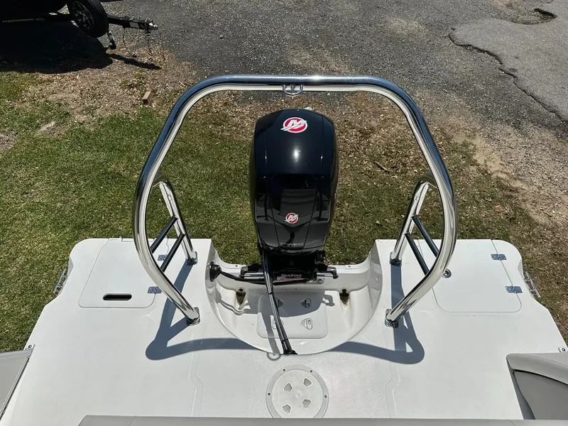 Slide: The Image of 2024 Hurricane FunDeck 2260 RE OB boat rear view with outboard motor. - 16