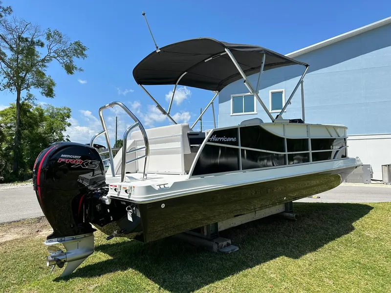 Slide: The Image of 2024 Hurricane FunDeck 2260 RE OB boat with canopy and outboard motor. - 3