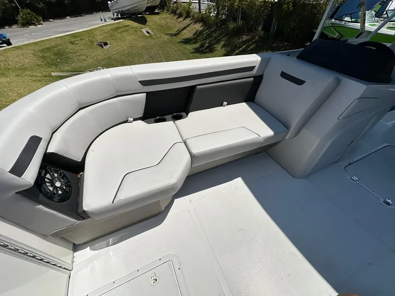 Slide: The Image of 2024 Hurricane FunDeck 2260 RE OB boat interior seating area with speaker. - 7