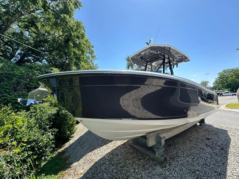The Image of 2024 Blackfin 252 CC boat on display outdoors. - 0