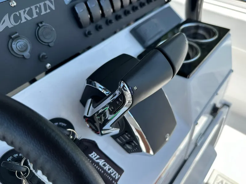 Slide: The Image of 2024 Blackfin 252 CC boat control panel and throttle. - 13