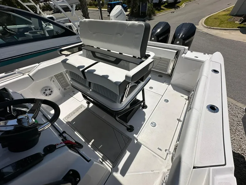 Slide: The Image of 2024 Blackfin 252 CC center console boat interior with dual outboard motors. - 14