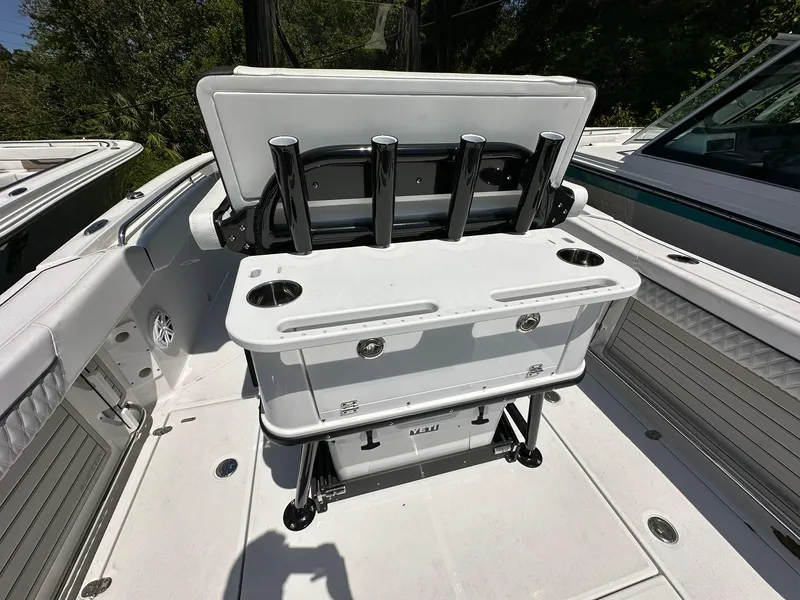 Slide: The Image of 2024 Blackfin 252 CC center console fishing boat with rod holders and storage compartments. - 15