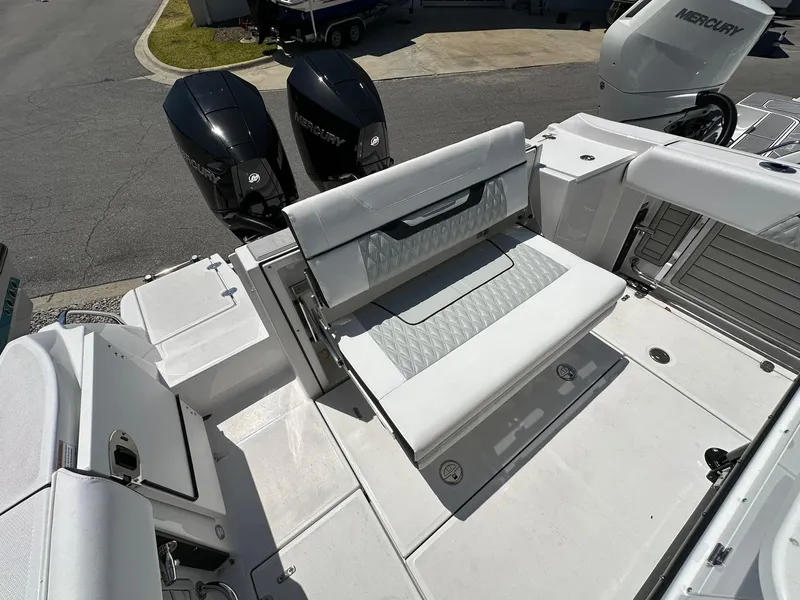 Slide: The Image of 2024 Blackfin 252 CC boat with dual Mercury engines and foldable rear seating. - 20