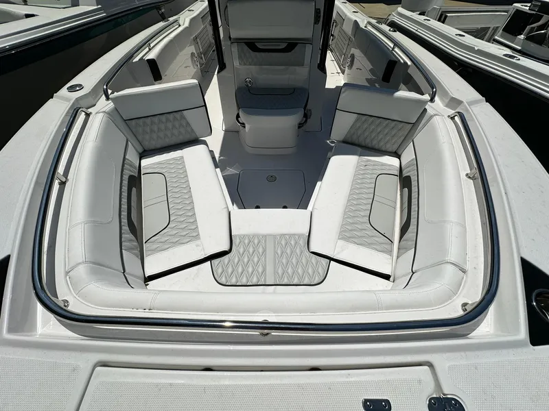 Slide: The Image of 2024 Blackfin 252 CC boat with spacious seating and modern design. - 6