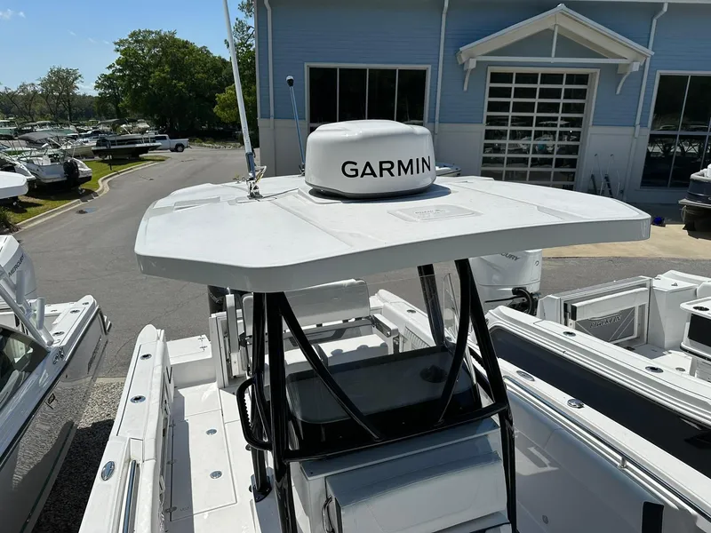 Slide: The Image of 2024 Blackfin 252 CC boat with Garmin radar at a marina. - 8
