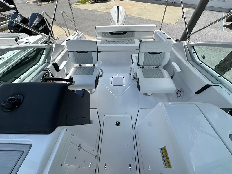 Slide: The Image of 2024 Blackfin 232 DC boat interior with white seating and modern design. - 12