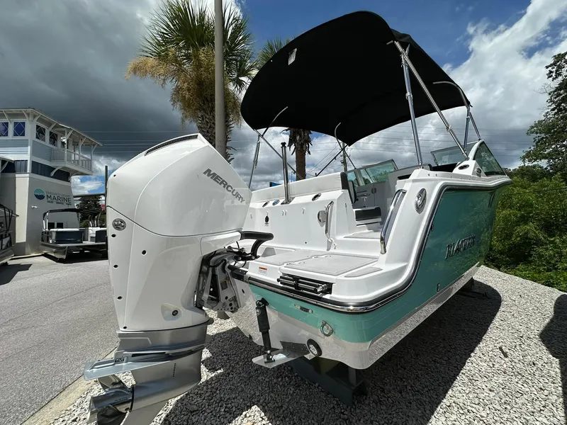Slide: The Image of 2024 Blackfin 232 DC boat on trailer at Emerald Coast Marine Center. - 2