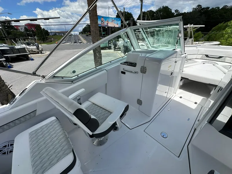 Slide: The Image of 2024 Blackfin 232 DC boat interior with seating and helm station. - 9