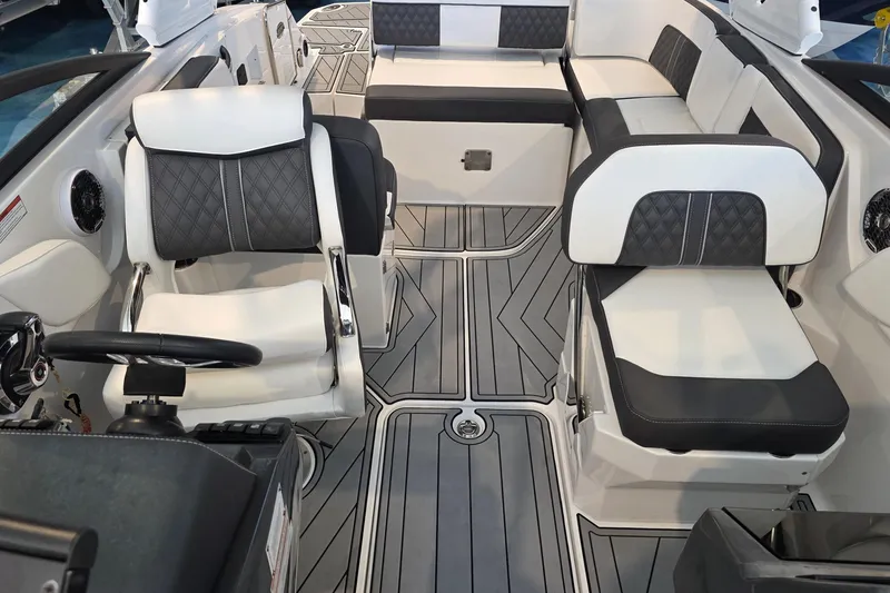 Slide: The Image of 2024 Monterey M-65 boat interior with modern seating and sleek design. - 13