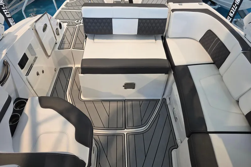 Slide: The Image of 2024 Monterey M-65 boat interior with sleek seating and modern design. - 14