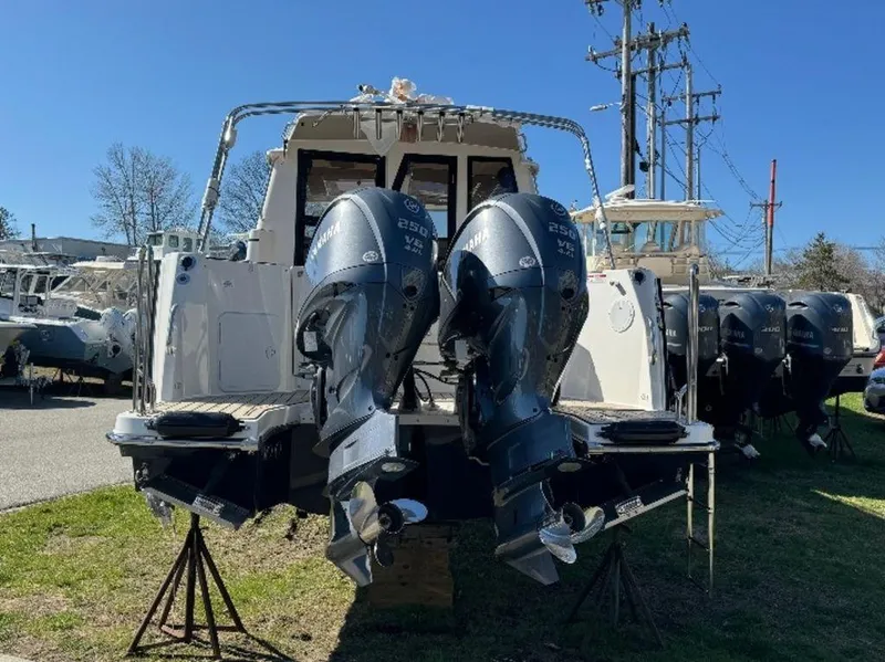 Slide: The Image of 2024 Cutwater C-288 C LE boat with dual outboard engines on display. - 4