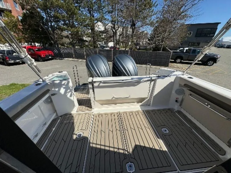 Slide: The Image of 2024 Cutwater C-288 C LE boat deck with twin outboard engines. - 8