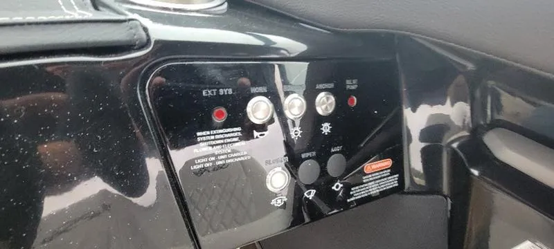 Slide: The Image of Control panel of 2024 Sea Ray SLX 260 boat with various buttons and indicators. - 1