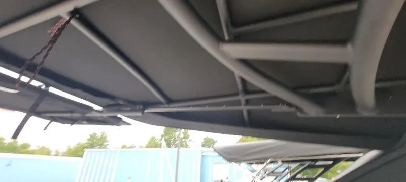 Slide: The Image of 2024 Sea Ray SLX 260 boat canopy structure, close-up view. - 15