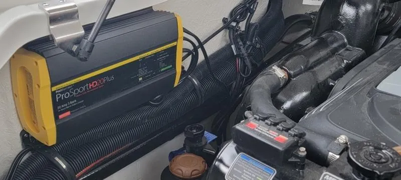 Slide: The Image of Engine compartment of 2024 Sea Ray SLX 260 with ProSport HD20 Plus charger. - 20