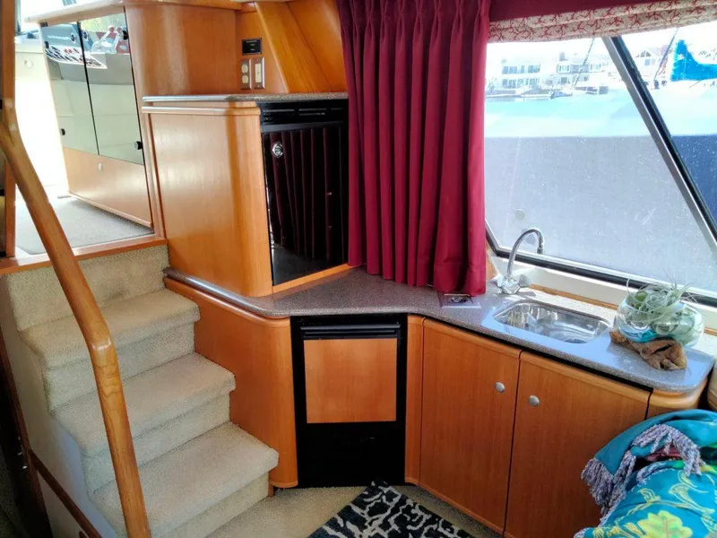 Slide: The Image of Interior of 1998 Bayliner 4788 Motoryacht with kitchen and stairs. - 14