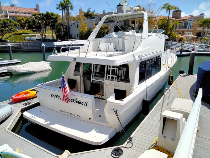 Slide: The Image of 1998 Bayliner 4788 Pilot House Motoryacht docked in marina. - 24