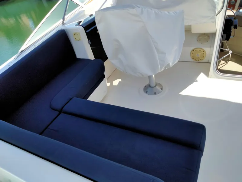 Slide: The Image of Interior of 1998 Bayliner 4788 Motoryacht with blue seating. - 7