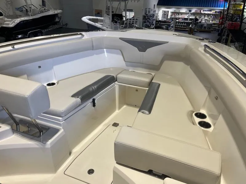 Slide: The Image of 2025 Sailfish 312 CC boat interior with spacious seating and modern design. - 12