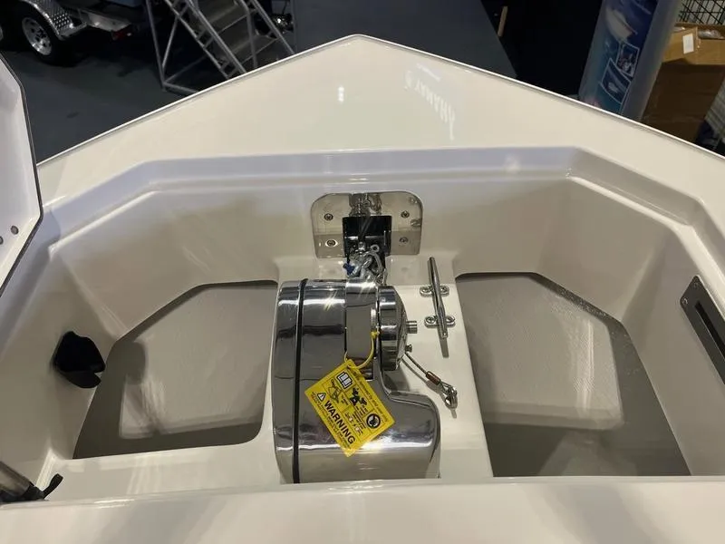 Slide: The Image of 2025 Sailfish 312 CC boat anchor compartment with stainless steel hardware. - 14