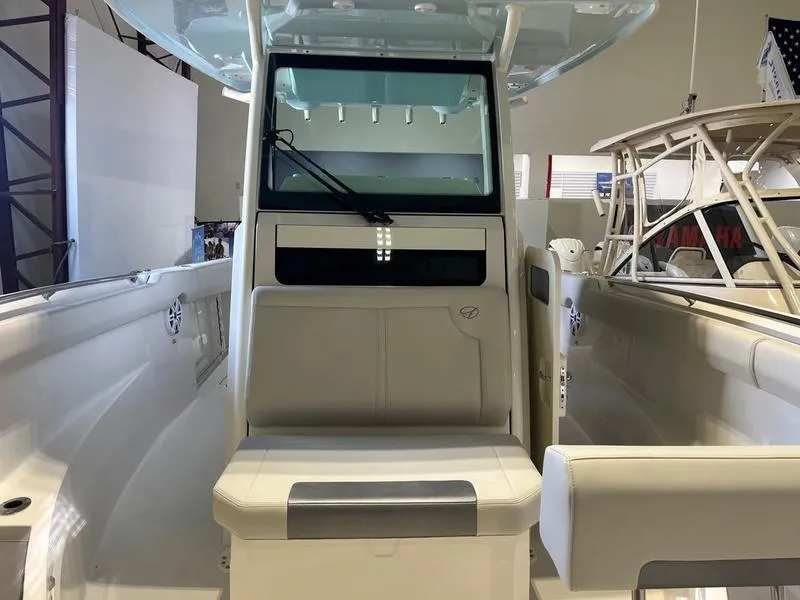 Slide: The Image of 2025 Sailfish 312 CC boat interior with seating and console. - 15