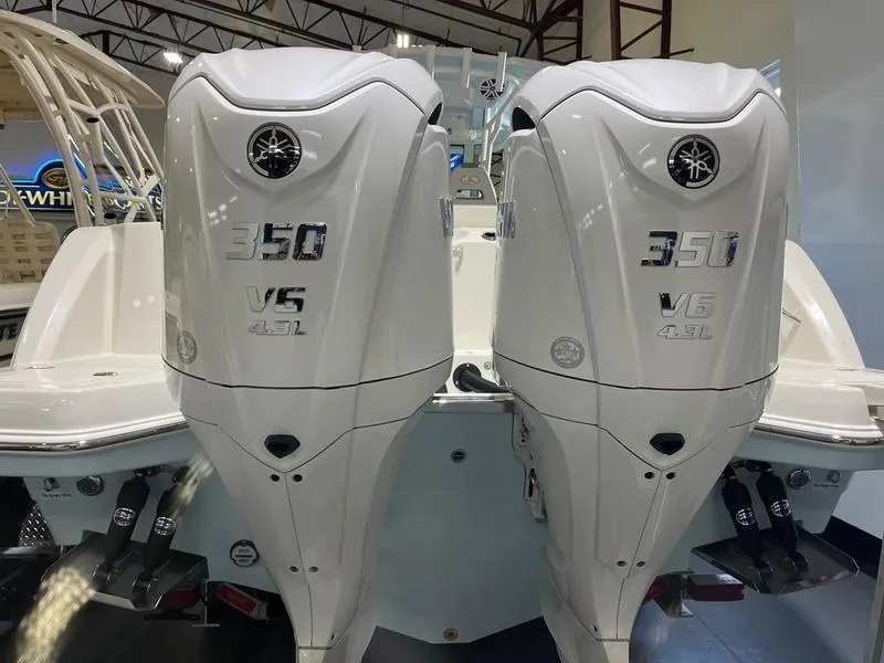 Slide: The Image of 2025 Sailfish 312 CC with dual 350 V6 outboard engines. - 5