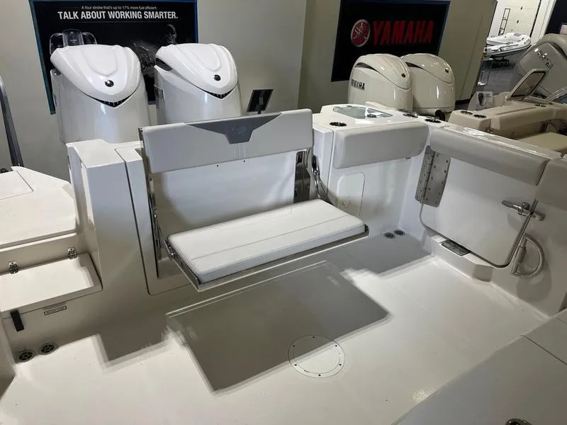 Slide: The Image of 2025 Sailfish 312 CC boat interior with Yamaha engines, featuring a foldable seat. - 6