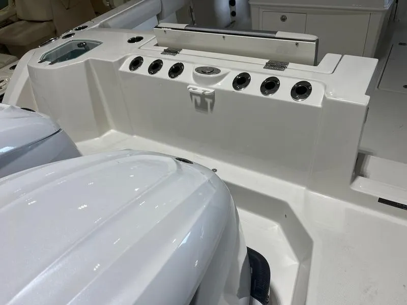 Slide: The Image of 2025 Sailfish 312 CC boat interior with dual engines and control panel. - 7