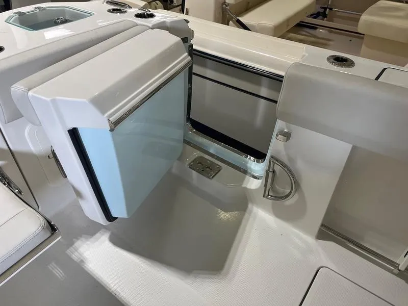 Slide: The Image of 2025 Sailfish 312 CC boat interior with modern seating and storage features. - 8