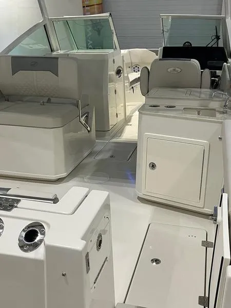 Slide: The Image of 2025 Sailfish 276 DC boat interior with seating and control console. - 12