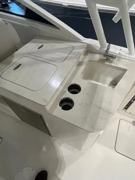 Slide: The Image of 2025 Sailfish 276 DC boat interior with sink and storage compartments. - 3