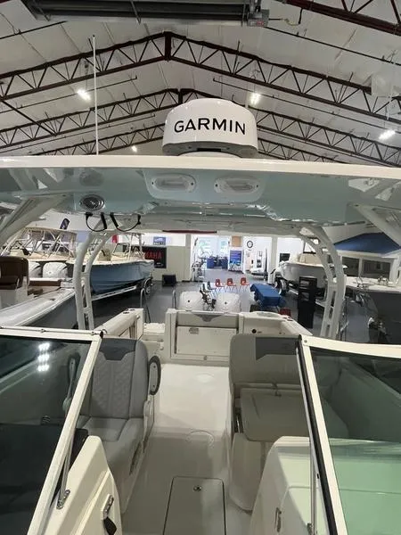 Slide: The Image of 2025 Sailfish 276 DC boat interior with Garmin electronics in showroom. - 5